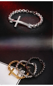 Detail of stainless steel box chain bracelets with large cross pendants in silver and gold