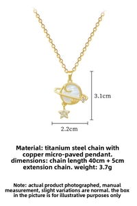 Detail of gold titanium steel planet pendant with shell inlay and micro-pave crystals