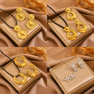 Four sets of gold and silver titanium steel teardrop pendant necklaces and earrings