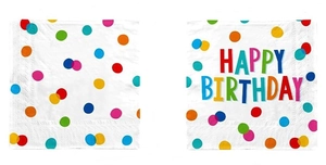 Close-up of white birthday napkins with colorful polka dots and Happy Birthday text