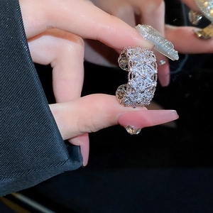 Macro shot of silver ring with pavé-set clear zircon stones showing sparkling details