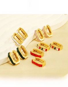 Detailed view of rectangular zircon earrings in 18K gold plated stainless steel