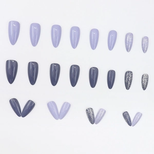 Almond shaped press-on nails in purple and greyish-purple with silver glitter accents
