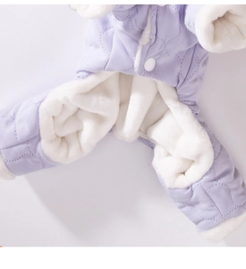 Detail of light purple quilted dog coat with thick white faux rabbit fur lining and buttons