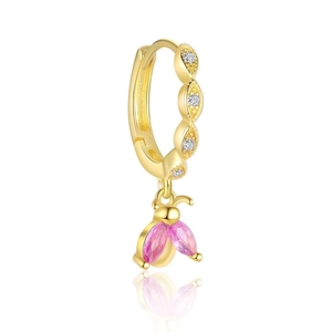 Macro shot of gold hoop earring featuring a bee charm with sparkling pink crystal wings