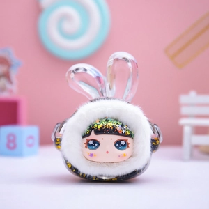 Detailed close-up of a cute plush blind box figure with bunny ears and glitter hair