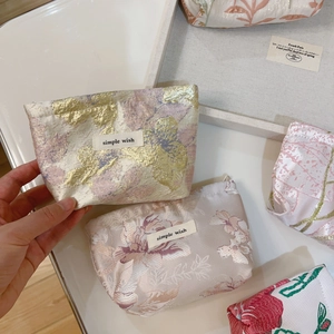 Detailed jacquard fabric mini pouches with floral embroidery and simple wish label