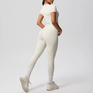 Detail of cream yoga set showing back seam construction and functional side pockets