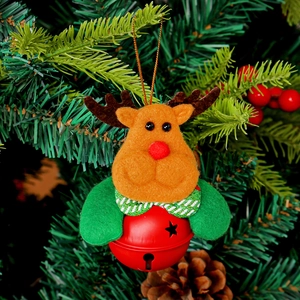 Cute reindeer Christmas bell ornament with star cutouts hanging on a festive pine tree branch