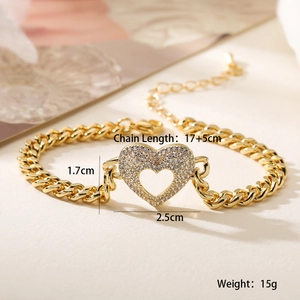 Detail view of gold heart pendant bracelet with dimensions and Cuban chain measurements