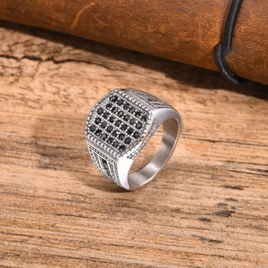 Detailed view of men's square ring with pave-set black zircon and vintage engraved textures