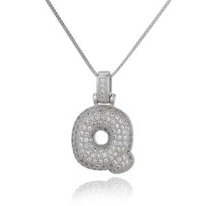 Macro shot of silver letter Q pendant with cubic zirconia on a delicate box chain