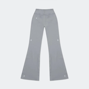 Flat lay of gray flared yoga pants featuring minimalist white geometric cross patterns