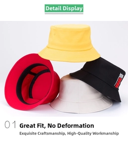 Detail of four colorful cotton bucket hats with red embroidery on the black model