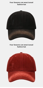 Close-up of distressed vintage baseball caps in black and dark red with letter embroidery