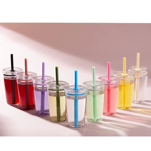 Nine colorful tritan cups with straws shown in various shades on a pink background