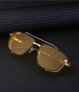 Detail of gold metal frame sunglasses with yellow lenses and industrial side mesh shields
