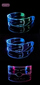 Close-up of LED glasses with slow color cycle and cyberpunk engraved patterns