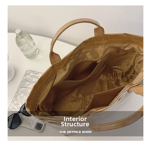 Detail view of large tote bag interior showing zipper pocket and dual slot pockets