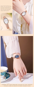 Detail of rose gold mesh strap watch with elegant oval mother of pearl dial for women
