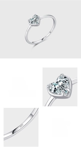 Macro view of S925 hallmark on polished silver band with heart-shaped zircon