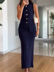 Detail of elegant navy two-piece knit set featuring sleeveless top with gold buttons