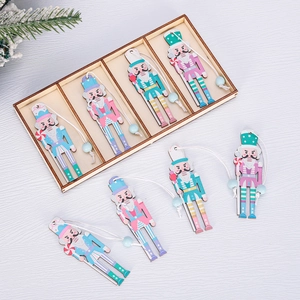Macro view of nutcracker wood ornaments in pastel colors with storage box