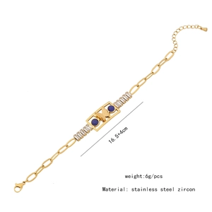 Detailed view of butterfly charm bracelet with blue stone and white zircon stones