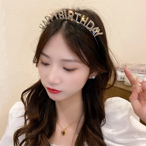 Elegant gold rhinestone Happy Birthday headband party accessory for women shown on model