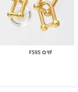 Close-up of 18K gold U-link chain earrings with polished metal sphere accents