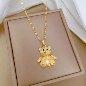 Luxurious gold-plated teddy bear necklace with full pavé crystals in a cream gift box