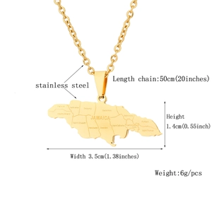 Detail view of golden Jamaica map necklace pendant with engraved districts and measurements