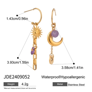 Detail view of gold stainless steel earrings with sun moon charms and size measurements