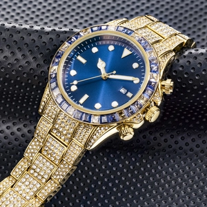 Macro shot of luxury gold-tone watch featuring blue rectangle gem bezel and diamond dial