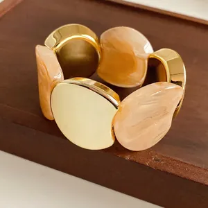 Elastic gold metal and marble resin patchwork wide bracelet with luxury mirror finish