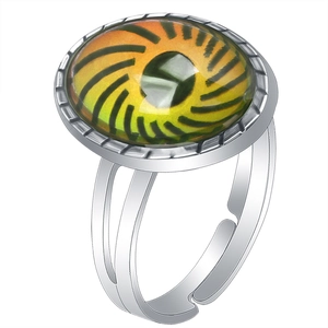 Macro shot of silver adjustable ring featuring a yellow-green color-changing gemstone