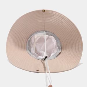 Detail of khaki sun hat featuring breathable mesh lining and adjustable windproof chin strap