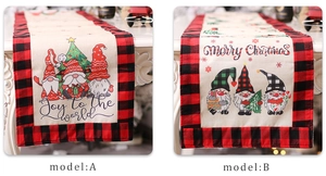 Detail of linen Christmas table runners with red plaid borders and gnome prints