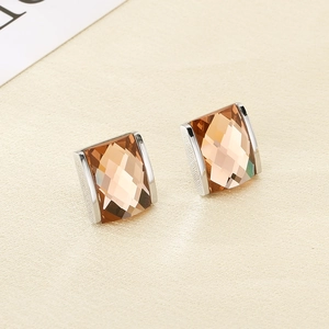 Macro shot of amber square geometric faceted glass earrings with silver brushed metal base