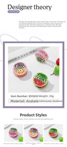Detail view of acetate fruit hair claws featuring watermelon, pineapple, and strawberry prints