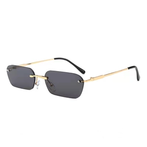 Frameless rectangular sunglasses with gold metal temples and dark black lenses