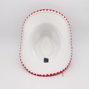Detailed top view of white jazz hat featuring red sawtooth ribbon trim and inner label