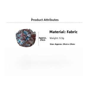 Detailed view of large marble print fabric scrunchie with size and weight specs