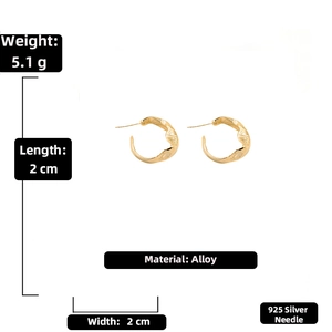 Detailed view showing the 925 silver needle and texture on these gold C-shape earrings