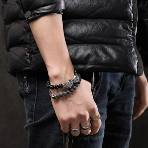 Men's titanium steel beaded bracelets and wolf head rings set with black lava stones