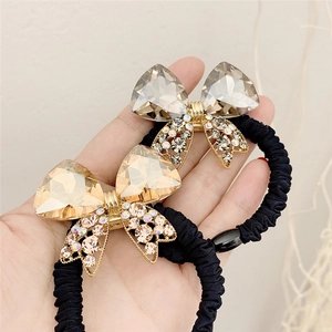 Sparkling crystal bow hair tie with champagne and grey faceted stones for women