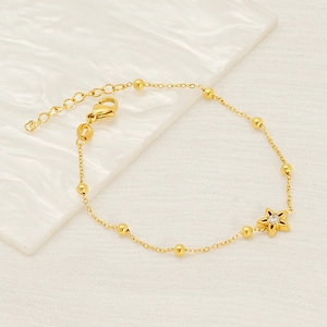 Elegant gold titanium steel bracelet with star pendant and sparkling crystal stone