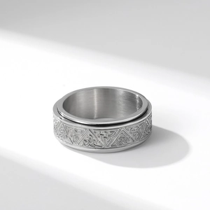 Rotating Celtic knot stainless steel anxiety ring with silver finish on white background