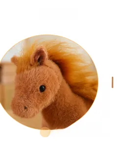 Close-up of cute plush horse doll with soft brown fur and golden mane detail