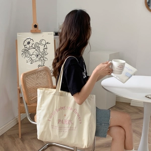 Off-white canvas tote bag with pink letter embroidery and large capacity for women